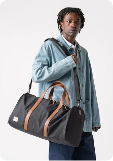 Man with duffel bag